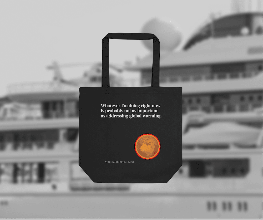 Black tote bag with climate message against mega yacht background