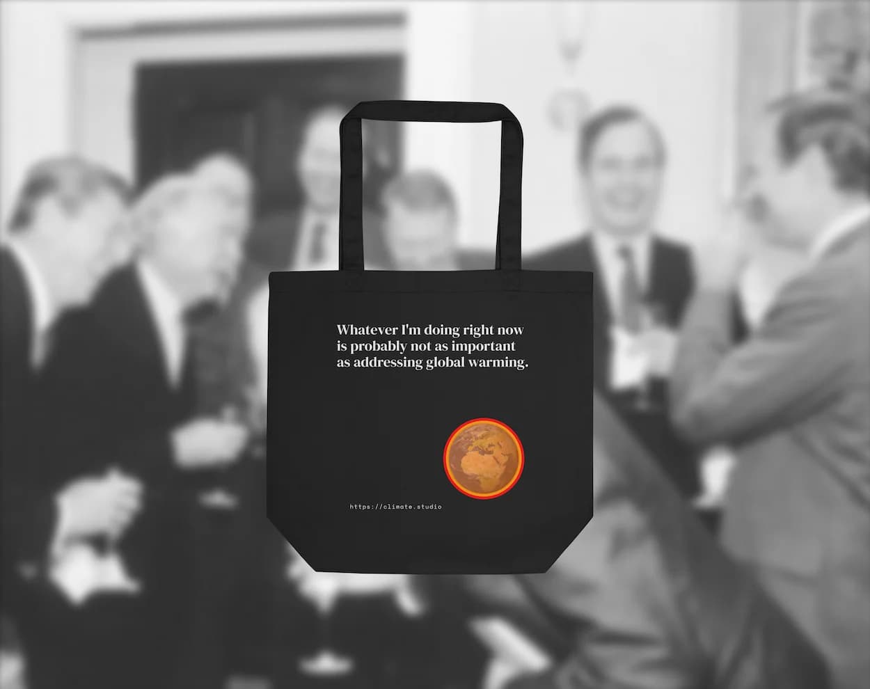 Black tote bag with climate message against neoliberal background