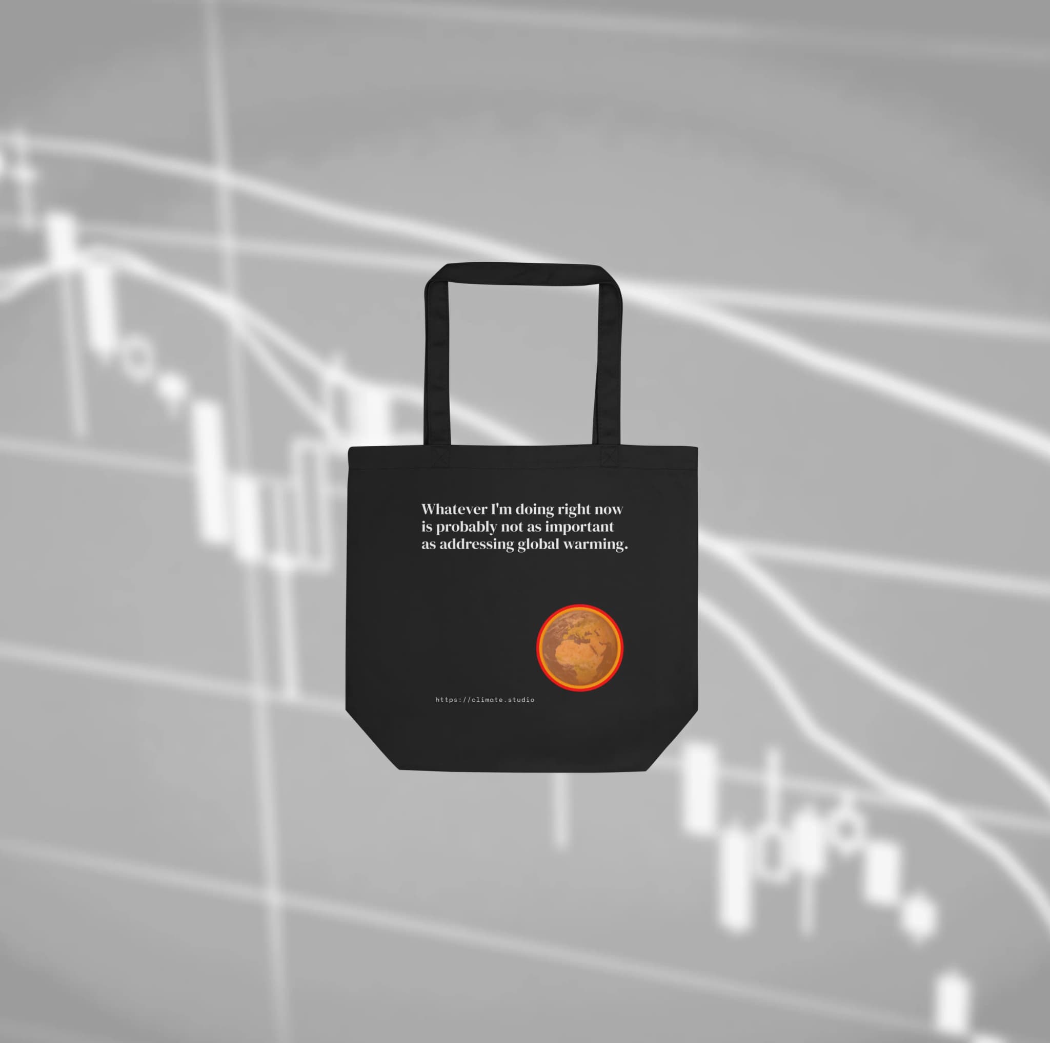 Climate Studio tote bag with global warming message against financial markets background