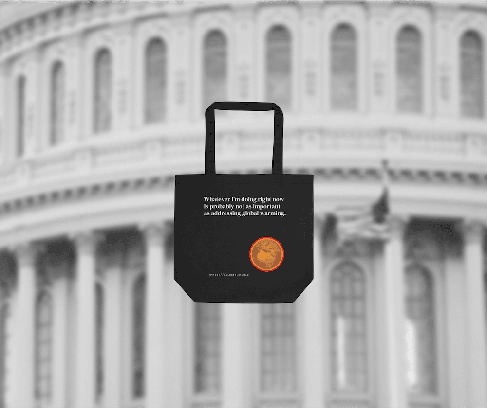 Black tote bag with climate message against US politics background
