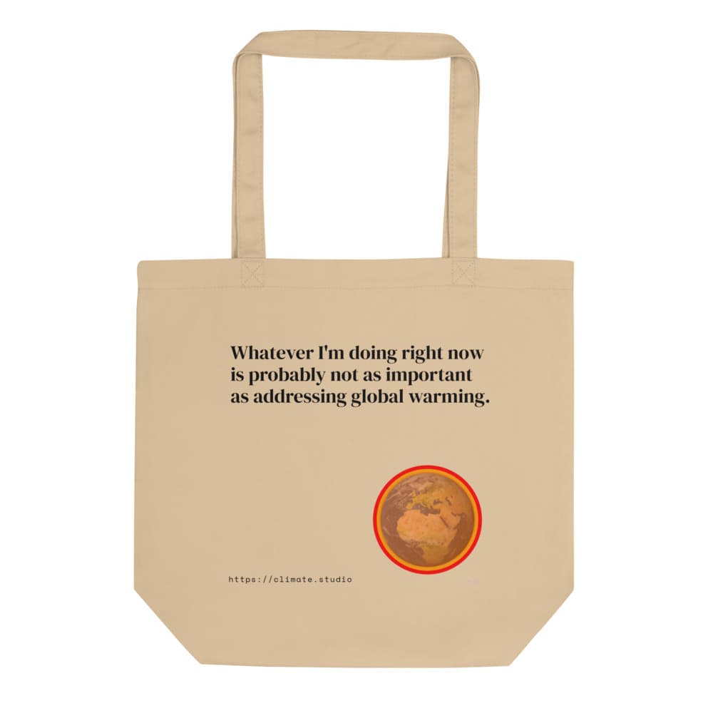 Beige tote bag with text reading 'Whatever I'm doing right now is probably not as important as addressing global warming' and an illustration of Earth with a red and orange border.